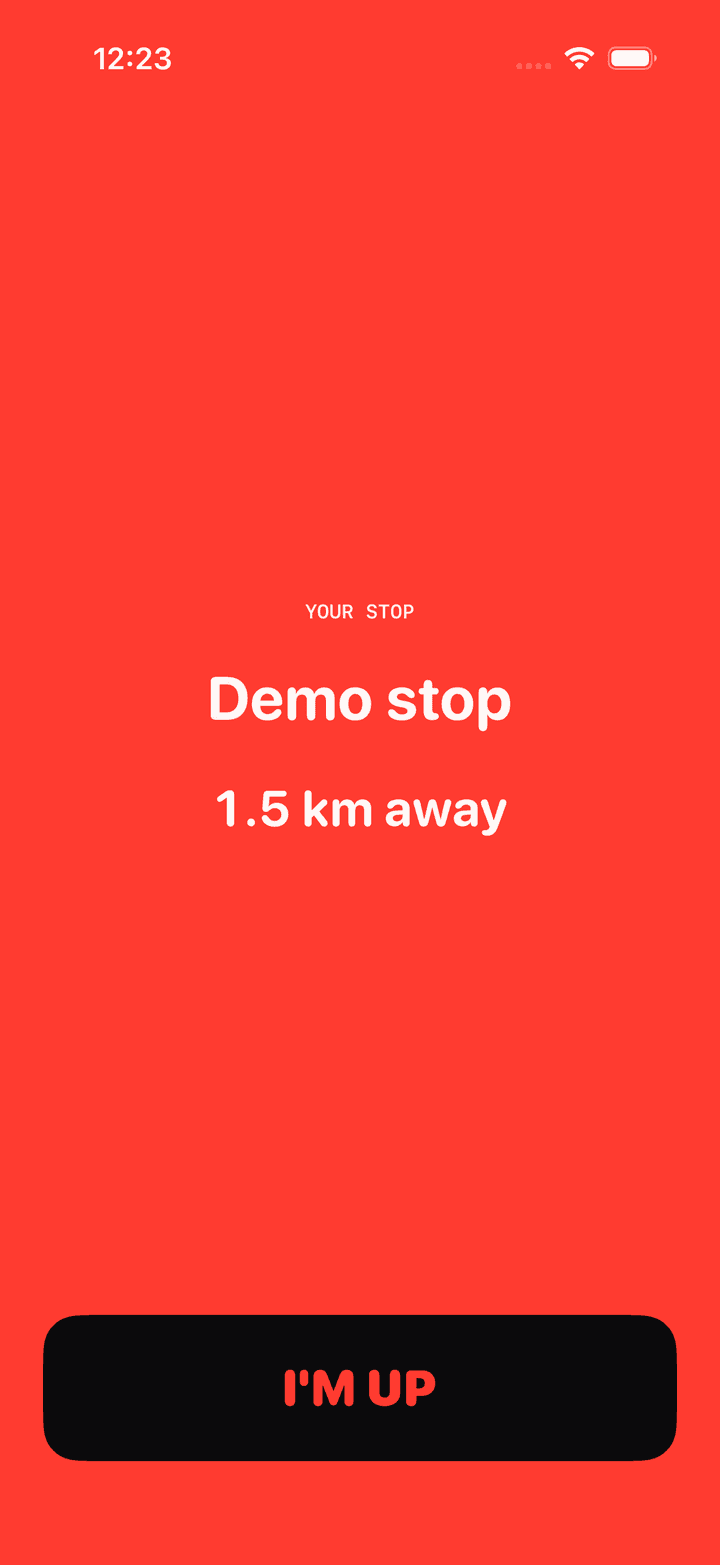 The Stopzone wake screen, the whole display turned red, naming the stop and offering a single I'm up button